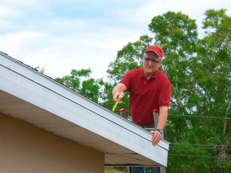 A person inspecting a new roof
